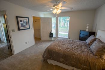 Bedroom With Expansive Windows at Residence at White River, Indianapolis, Indiana